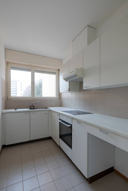 istock Old kitchen with oven, induction hob and sink. Bright window. 2012297936