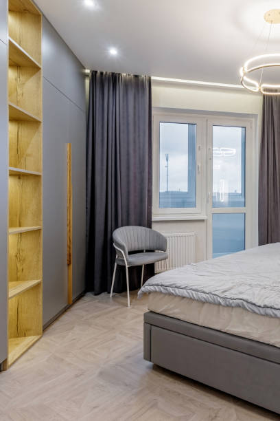 istock Luxury bedroom interior with double bed and gray window curtains 2012310888