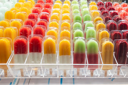 Colorful artisanal fruit popsicles, ice creams. shop selling ice cream.