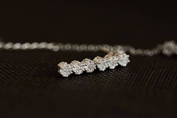 istock Closeup of a diamond necklace on a dark surface 2012345698