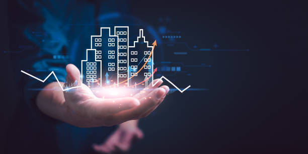 istock Businessman holding building of real estate development icons. Engineering and construction. Investment and business Buy and sell houses and online commercial enterprises, residential realty assets. 2012345732