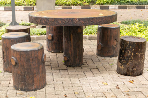 istock Stone table and benches with wood texture in the garden 2012346229