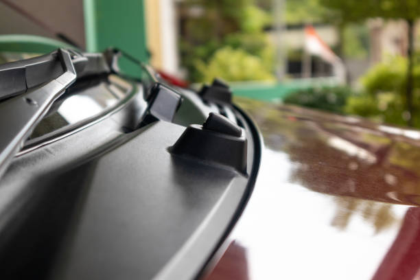 istock Car windshield sprayer hole and wipers or windscreen washer nozzle in the red car 2012346293