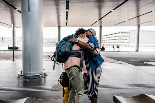 Mature couple embracing at airport