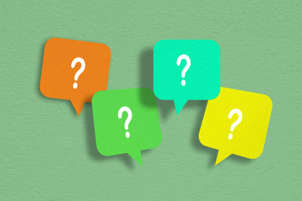 istock Question mark on multicolor speech bubbles with paper texture on grunge green concrete background 2012348788