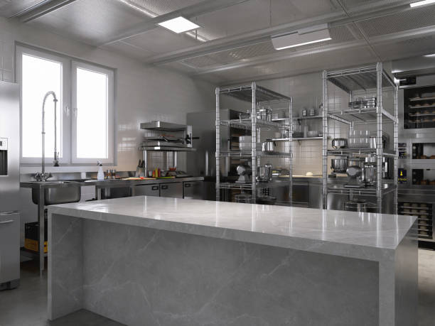 istock Empty clean white marble top counter table in commercial, professional bakery kitchen, stainless steel convection deck oven, sink, refrigerator, shelf, cabinet 2012371614