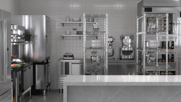 istock Empty clean white marble top counter table in commercial, professional bakery kitchen with stainless steel convection deck oven, refrigerator, shelf, cabinet 2012372117
