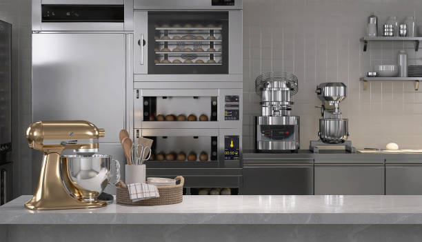 istock New gold professional kneading machine on white marble counter table in commercial bakery kitchen with stainless steel oven, refrigerator, shelf, cabinet 2012372123
