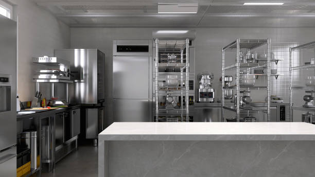 istock Empty clean white marble top island table in commercial, professional bakery kitchen with stainless steel convection, deck oven, freezer, refrigerator, shelf, cabinet, bread, bun 2012372133