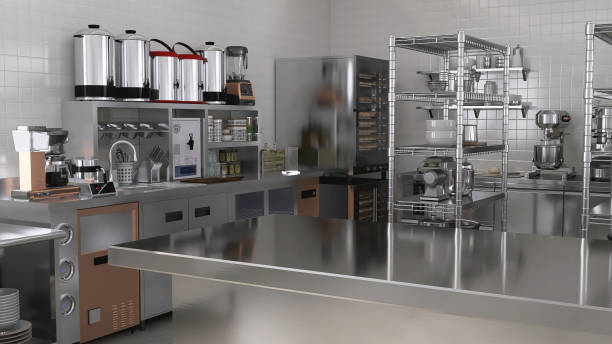 istock Empty clean stainless steel counter table in commercial, professional bakery kitchen with convection, deck oven, refrigerator, sink in sunlight from window 2012372142