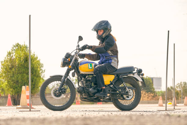 istock Woman riding motorcycle on motordrome 2012374264