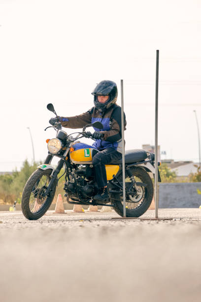 istock Serious biker riding motorcycle on motordrome 2012374789