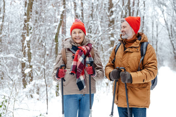 istock Mature couple having a walk with scandinavian sticks 2012386559