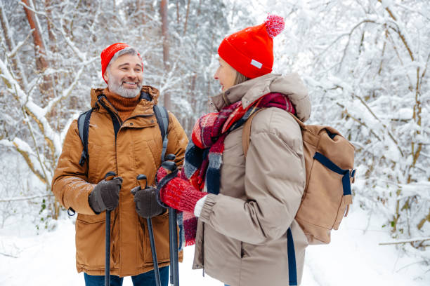 istock Man and woman feeling excited and contented on a winter walk 2012386564