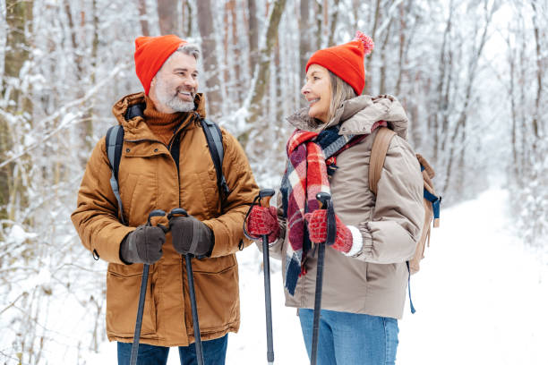 istock Mature couple having a walk with scandinavian sticks 2012386571