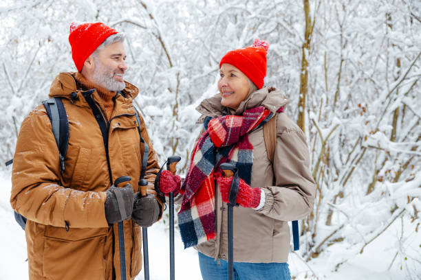 istock Man and woman feeling excited and contented on a winter walk 2012386582