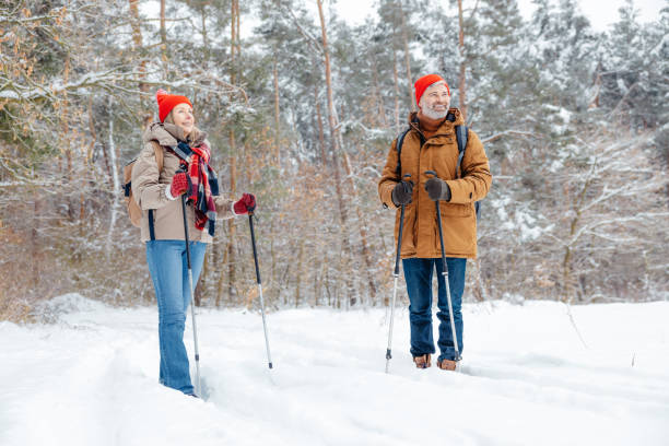 istock A mature couple spending good time together in a winter forest 2012386595