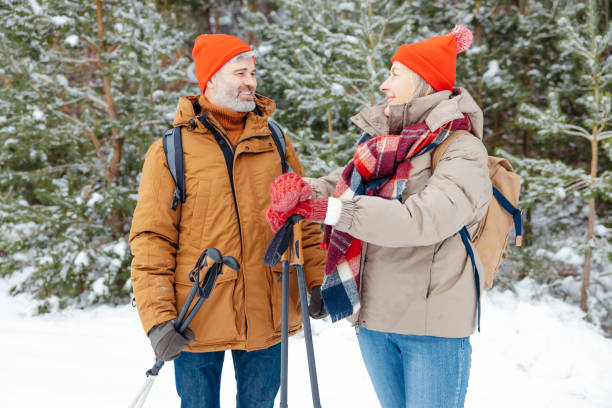istock A mature couple spending good time together in a winter forest 2012386607
