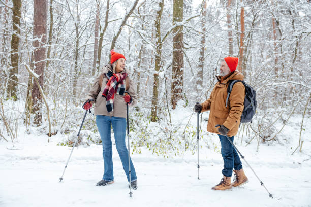 istock A couple having a walk in a winter forest and looking contented 2012386757