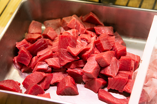 Fresh tuna at a food stall at the Tsukiji Outer Market in the city of Tokyo in Japan..