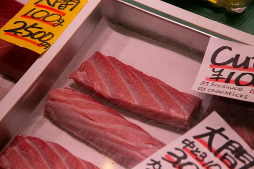 Fresh tuna at a food stall at the Tsukiji Outer Market in the city of Tokyo in Japan..