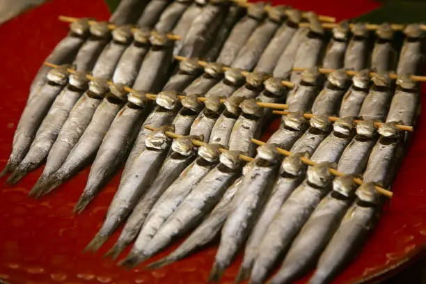 Photo of Ayu River fish at a food stall at the Tsukiji Outer Market in the city of Tokyo in Japan.