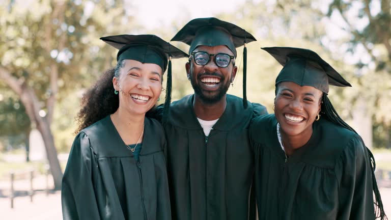 Face, graduation and happy group of students in university, laugh and friends together outdoor. Portrait, graduate and African people with achievement for education, celebration or success at college