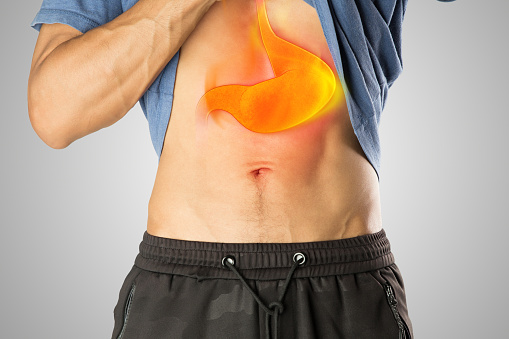 A man has a burning sensation in his chest because he has symptoms of acid reflux.