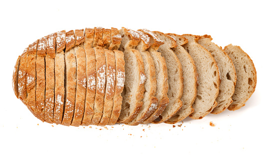 Sliced loaf of baked bread on a white isolated background