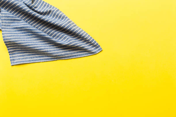 istock top view with blue kitchen napkin isolated on table background. Folded cloth for mockup with copy space, Flat lay. Minimal style 2012438178