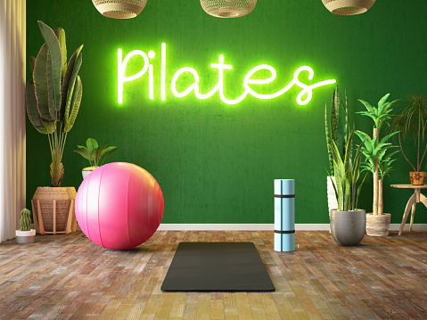 Neon Pilates Sign on Green Room's Wall. Yoga Mat Pilates Ball and Green Indoor Plants. 3D Render