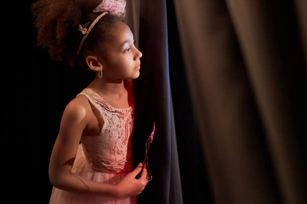Black Girl Peeking Over Curtain
