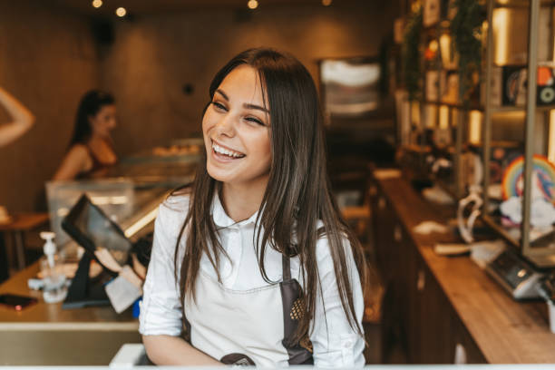 istock Happy young woman working in confectioner 2012475014