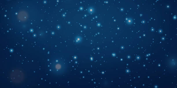istock Blue dust of light. Bokeh light effect background. glowing background of dust and light glitter. 2012488218
