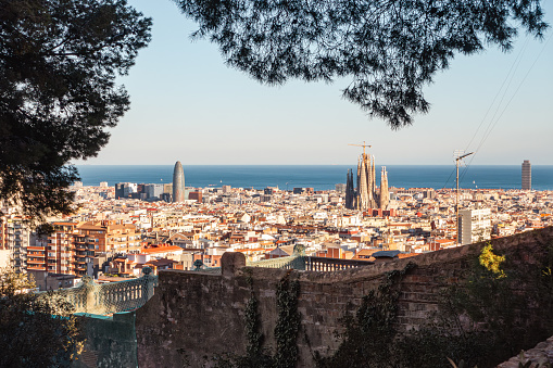 Barcelona, panoramic view. Sagrada Familia, Torre Glòries tower (Torre Agbar) and the sea.