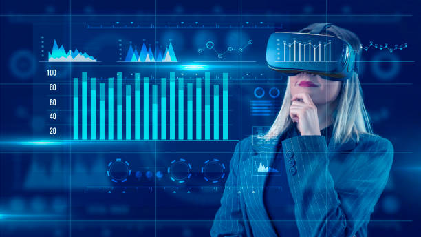 istock Young businesswoman using VR glasses with digital media interface.She’s working on a new project. She looks very busy. Blue hologram. Analytics. Virtual reality technologies for education GUI (Graphical User Interface) concept. 2012518498