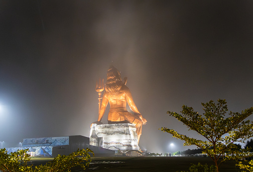 back view of hindu god lord shiva isolated statue at night from different angle image is taken at statue of belief nathdwara rajasthan india.