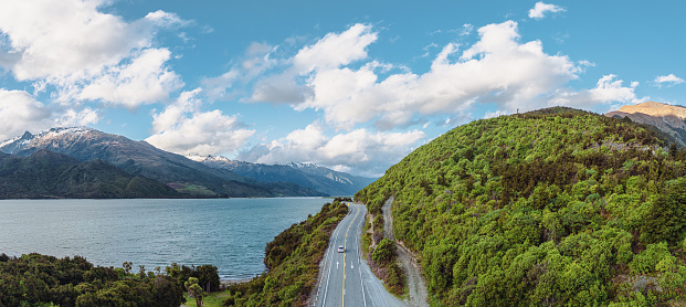 Embark on a breathtaking journey along the picturesque Lake Wakatipu on the road from Queenstown to Glenorchy, New Zealand. Explore stunning landscapes.