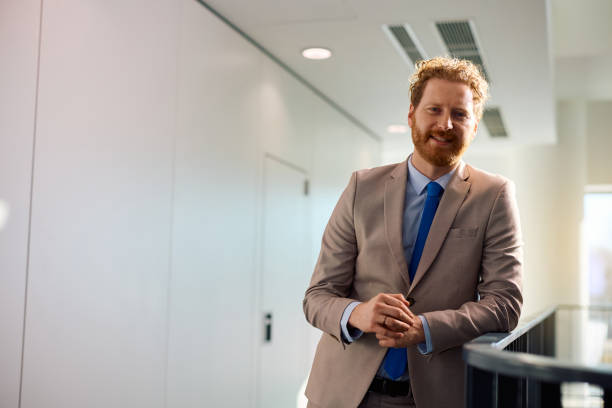 istock Male entrepreneur working at corporate office and looking at camera. 2012562466