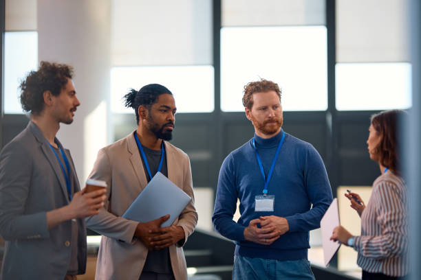 istock Group of entrepreneurs talking while attending a business seminar at convention center. 2012568064
