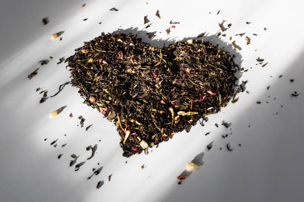 istock Scattered tea on the table. Tea in the sunlight from the window 2012592401