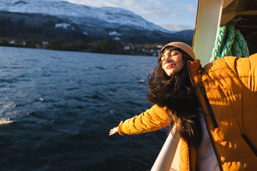 Cruise vacation travel woman enjoying freedom with open arms.