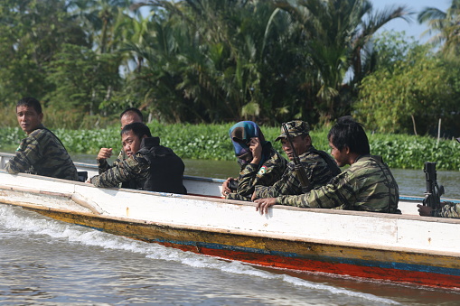 This caption highlights the resilience of MILF guerrillas as they continue their journey through the rivers of Mindanao, using carved boats as a symbol of their determination and strength.