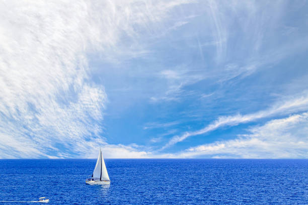 istock Boat, sailboat sailing on the beach of Mallorca under a blue sky with white clouds 2012607788