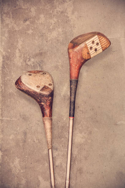 istock Ancient golf clubs in front of an old wall 2012613752