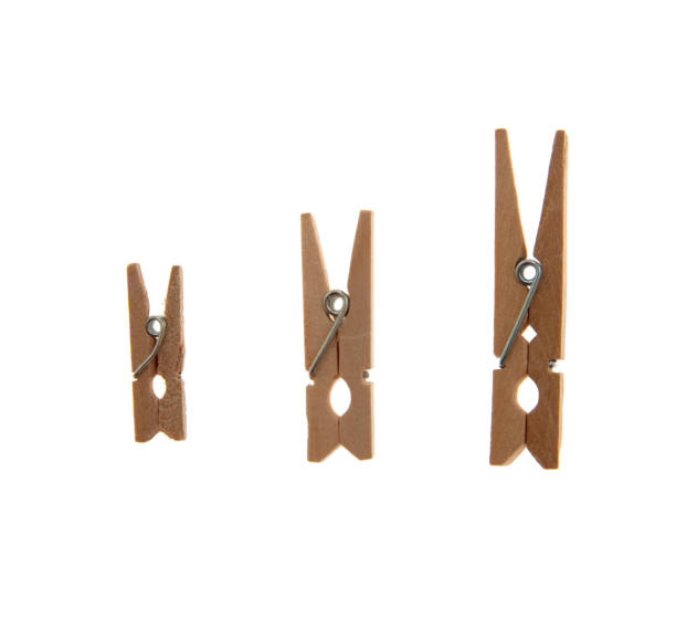 istock Clothes pegs isolated on white transparent, three sizes natural color clothepins, 2012624518