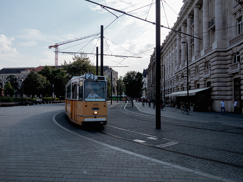 Buscharest, Hungary - August 18, 2023: A tram runs along a street in Bucharest downtown.