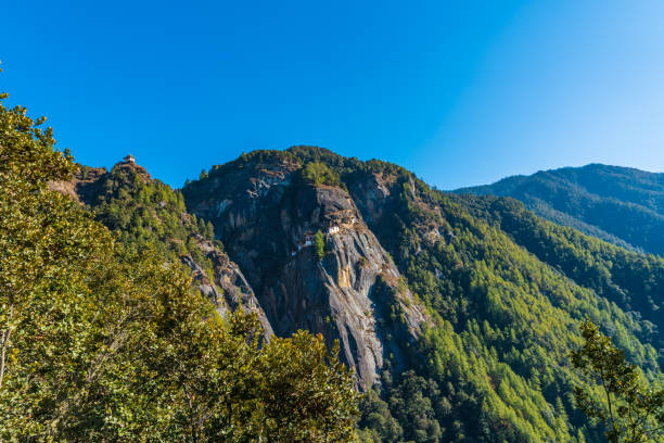 View of the Tigers Nest Monastery with layers of  green mounntains all round