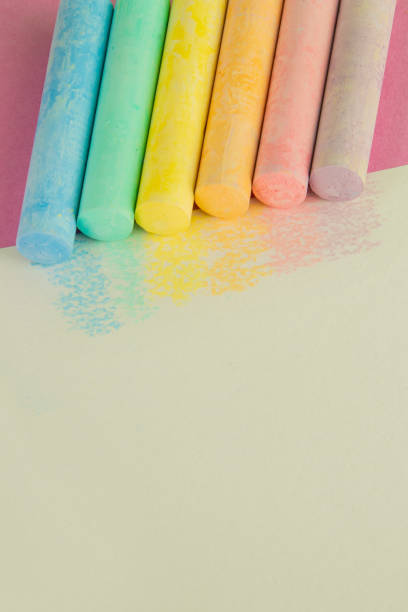 Chalk for drawing on a pink background. Children's chalk for drawing.