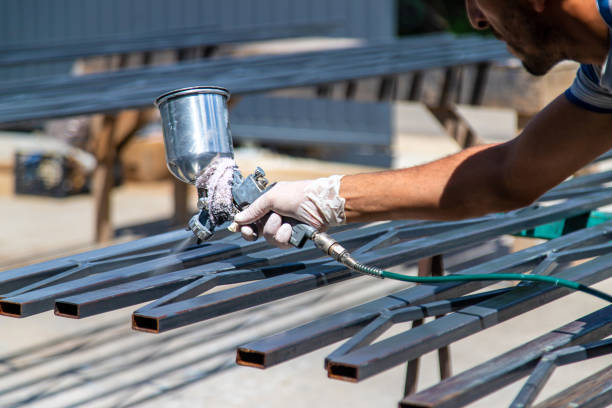 istock A man spray paints metal. Selective focus. 2012671251